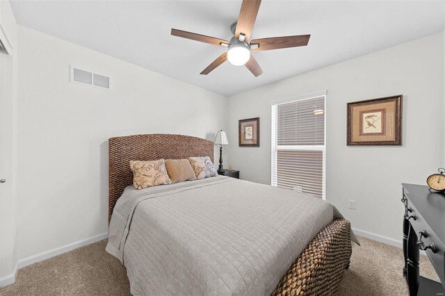 bedroom with visible vents, baseboards, carpet, and ceiling fan