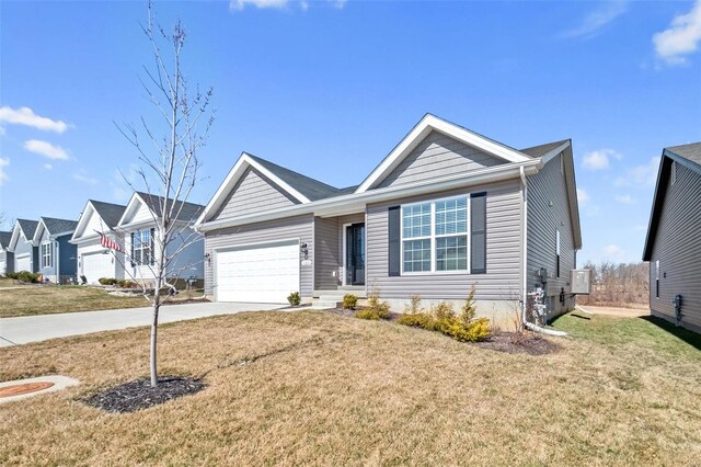 ranch-style house featuring a front lawn, a garage, and driveway