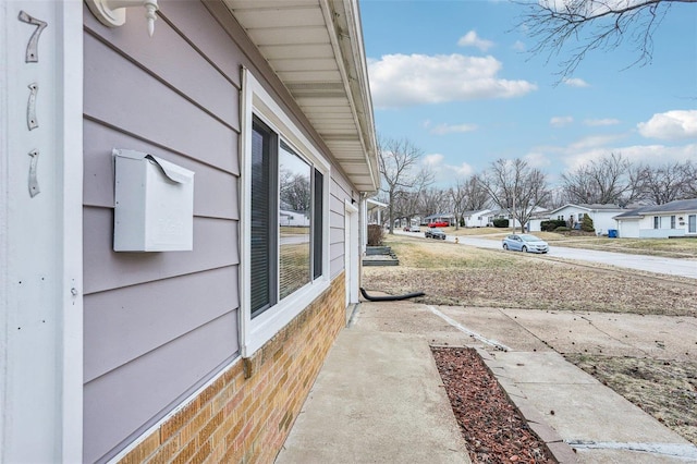 view of yard featuring a residential view