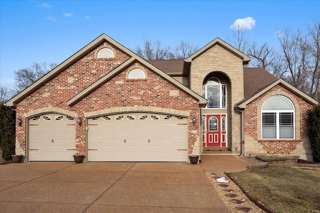 view of front of property with brick siding, a shingled roof, a garage, stone siding, and driveway