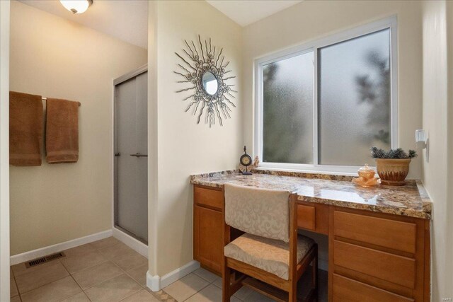 full bath with tile patterned flooring, visible vents, baseboards, and an enclosed shower