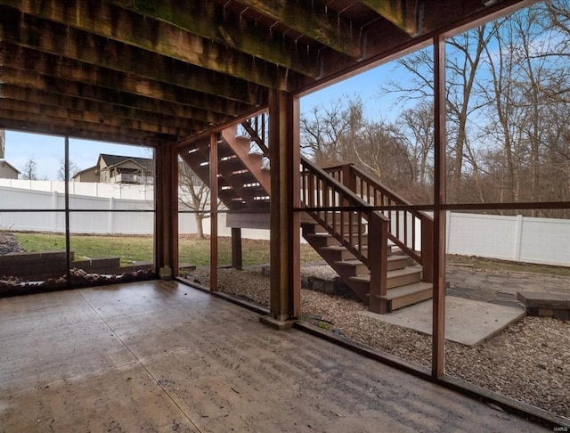 exterior space featuring a fenced backyard and stairway