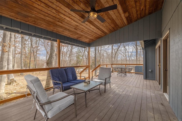 unfurnished sunroom featuring wood ceiling, vaulted ceiling, and ceiling fan