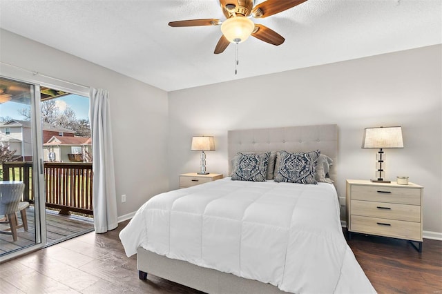 bedroom featuring access to outside, a textured ceiling, baseboards, and dark wood-style flooring