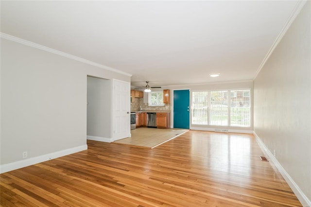 unfurnished living room featuring light wood finished floors, baseboards, ornamental molding, and ceiling fan