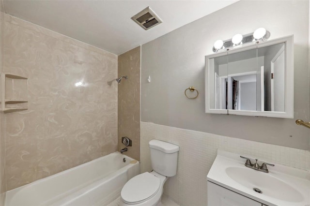 full bath with shower / bath combination, visible vents, toilet, vanity, and tile walls