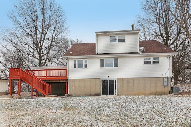 rear view of house featuring a shingled roof, stairway, a deck, and cooling unit