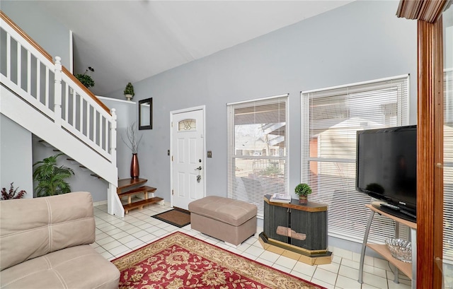 tiled living room featuring stairs