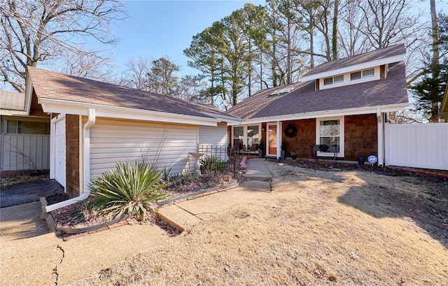 view of front facade featuring a porch and fence