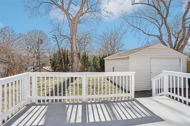 exterior space with an outbuilding and a detached garage