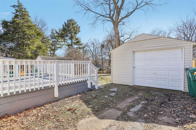 detached garage featuring driveway