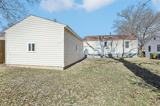 back of property featuring a yard