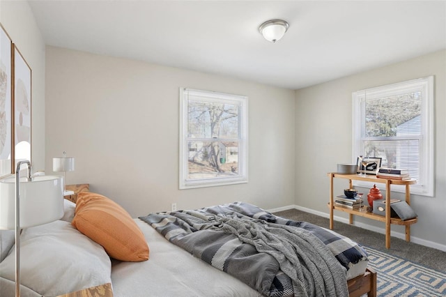 carpeted bedroom with baseboards