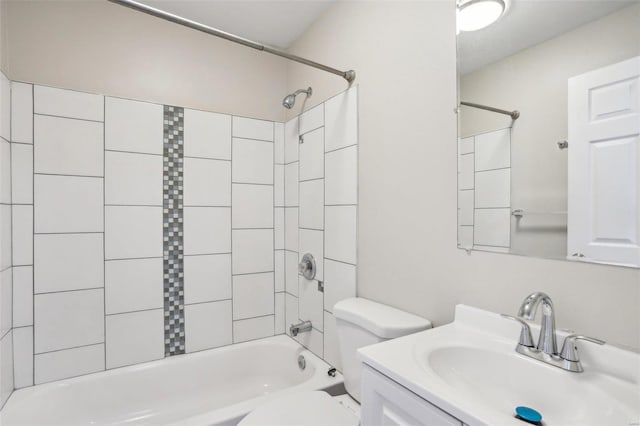 bathroom featuring vanity, shower / tub combination, and toilet