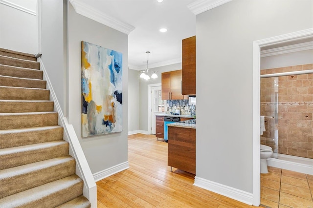 interior space featuring recessed lighting, a notable chandelier, baseboards, ornamental molding, and wood-type flooring