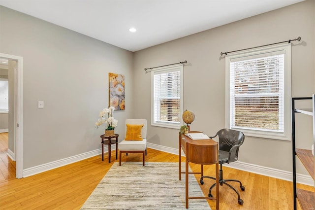 home office featuring light wood finished floors, baseboards, and recessed lighting