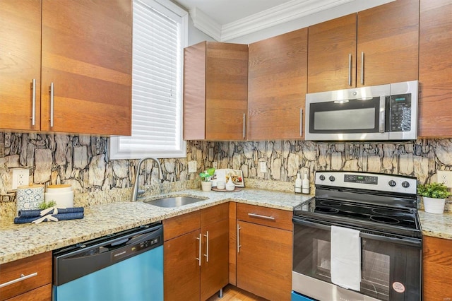 kitchen featuring crown molding, stainless steel microwave, electric range oven, a sink, and dishwashing machine