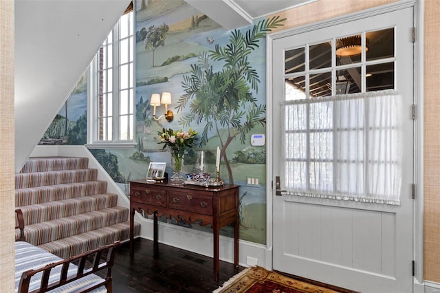 doorway featuring wallpapered walls, wood finished floors, and visible vents