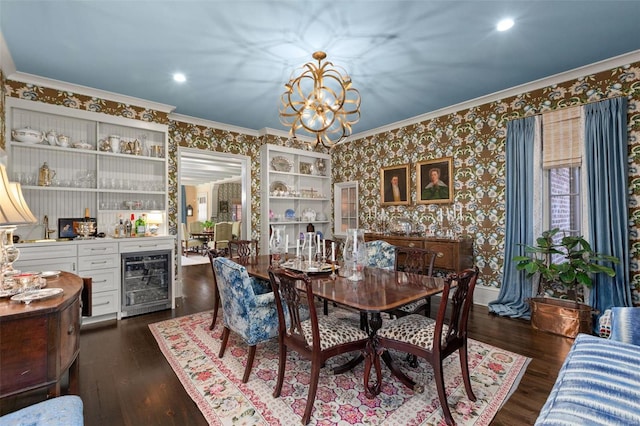 dining room featuring dark wood-type flooring, beverage cooler, ornamental molding, and wallpapered walls