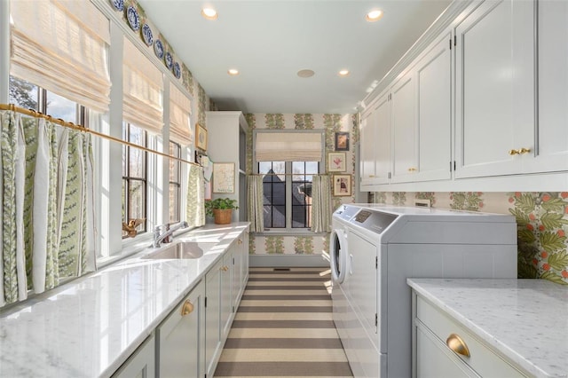 laundry room with recessed lighting, cabinet space, wallpapered walls, and separate washer and dryer