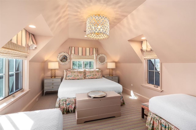 bedroom featuring baseboards, carpet floors, and vaulted ceiling