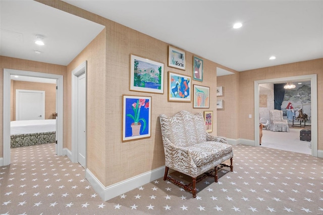 sitting room featuring recessed lighting, wallpapered walls, baseboards, and carpet floors