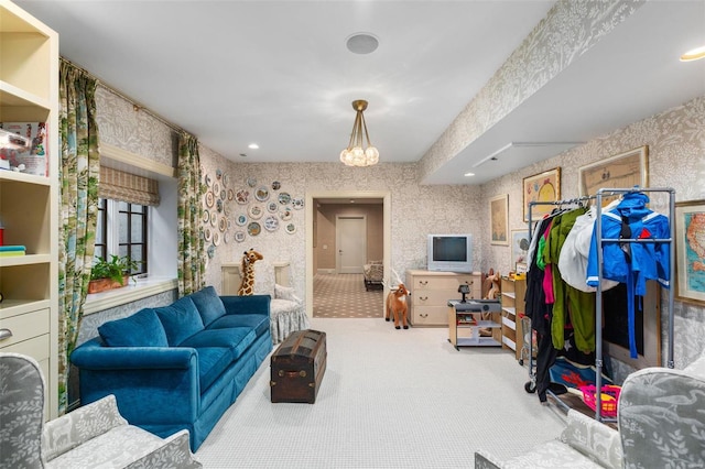 living room featuring carpet and wallpapered walls