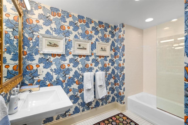 bathroom featuring tile patterned flooring, wallpapered walls, baseboards, and a sink