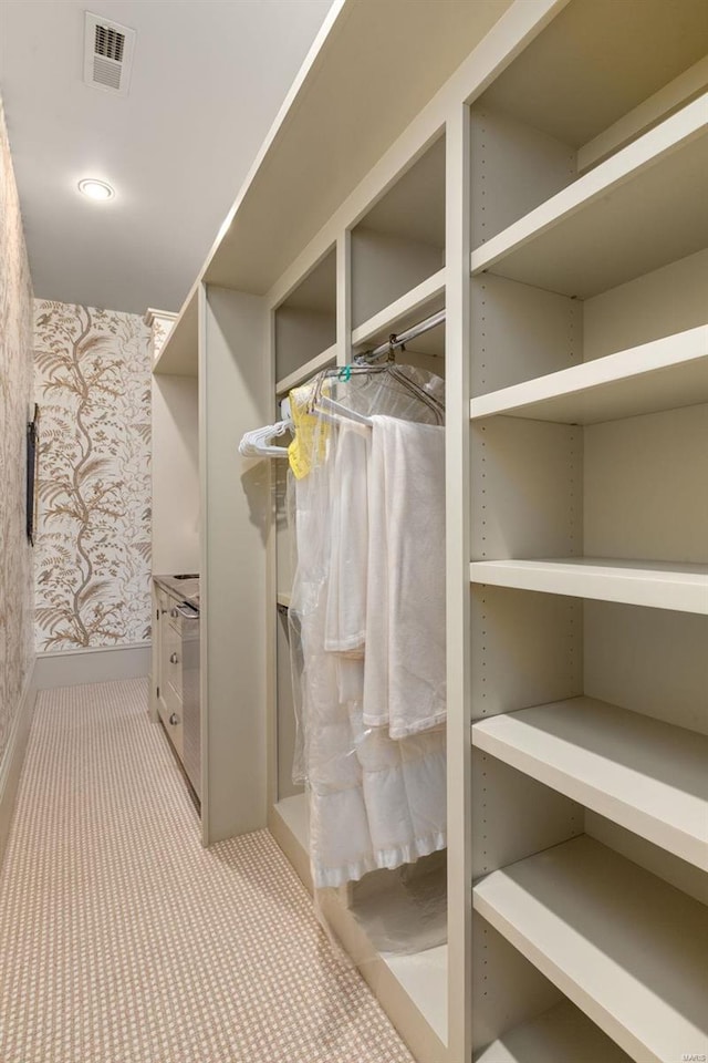 walk in closet with visible vents