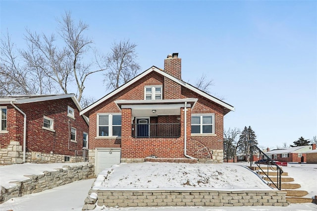 bungalow-style house featuring an attached garage, a chimney, and brick siding