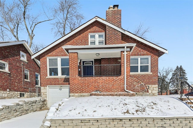 exterior space featuring a garage, a chimney, and brick siding