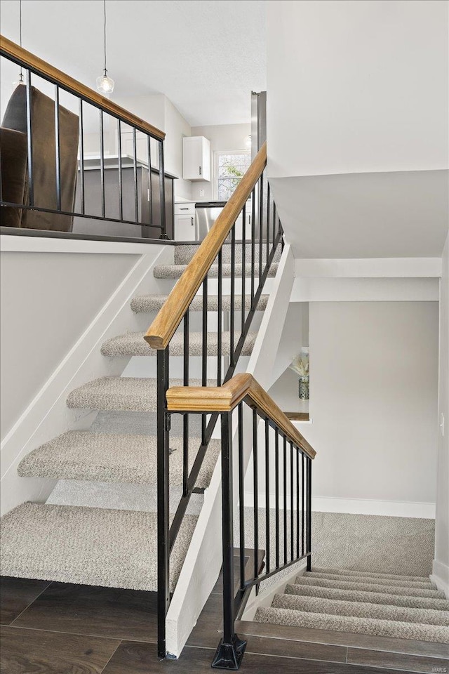 staircase featuring baseboards