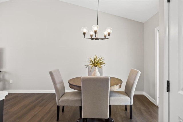 dining area with dark wood-type flooring and baseboards