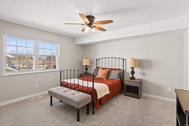 bedroom featuring light carpet, baseboards, and visible vents