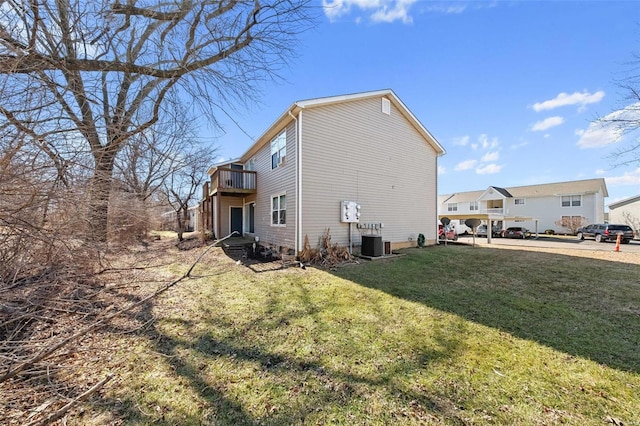 view of property exterior featuring central AC unit and a lawn