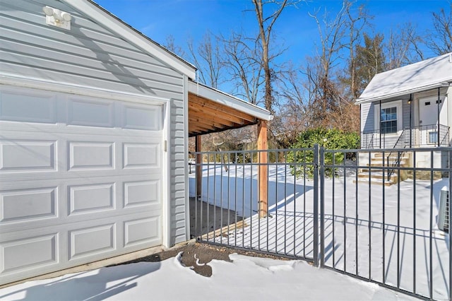 view of snow covered garage