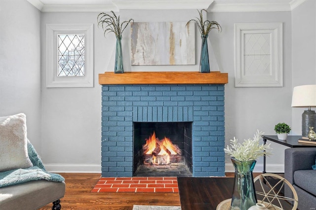 interior space with crown molding, a fireplace, baseboards, and dark wood-style floors