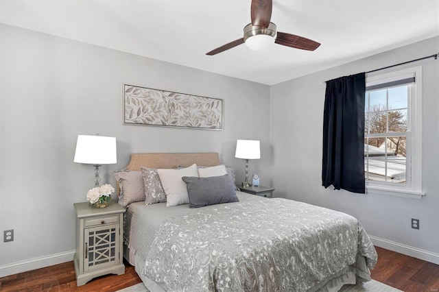 bedroom with wood finished floors, a ceiling fan, and baseboards