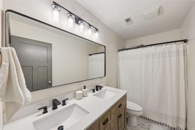 bathroom with toilet, marble finish floor, visible vents, and a sink