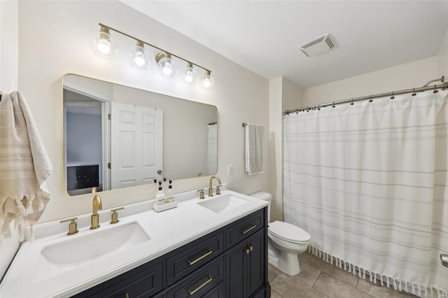 full bath with tile patterned flooring, visible vents, a sink, and toilet