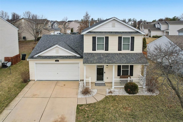 traditional home featuring a porch, an attached garage, a shingled roof, driveway, and a front yard