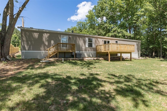 back of property featuring central AC, a lawn, and a wooden deck