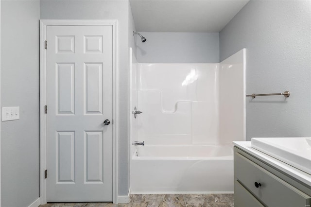 bathroom featuring shower / bath combination and vanity