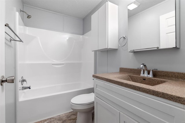 full bath with shower / tub combination, a textured ceiling, toilet, and vanity