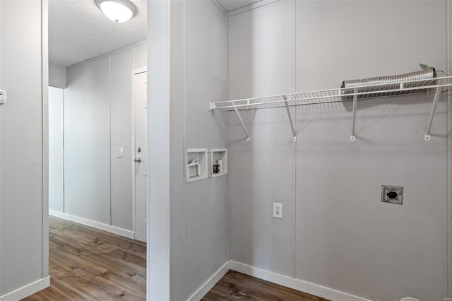 washroom with a textured ceiling, washer hookup, wood finished floors, and electric dryer hookup