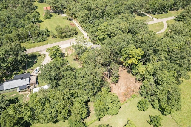 birds eye view of property with a view of trees