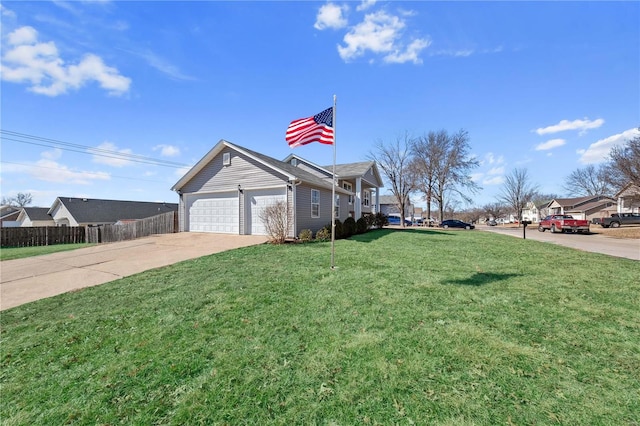 exterior space featuring driveway, a yard, an attached garage, and fence