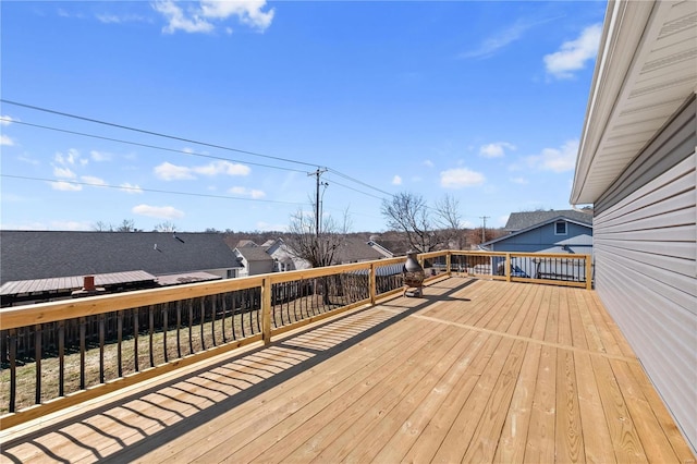 wooden terrace with a residential view