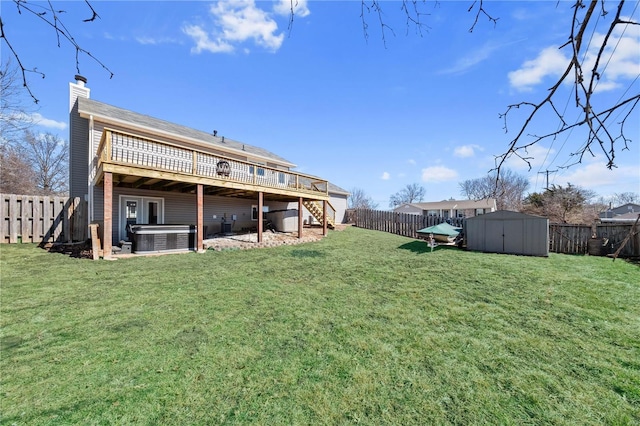 back of house featuring central air condition unit, a hot tub, a fenced backyard, a wooden deck, and stairs