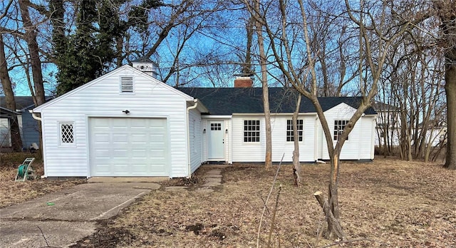 single story home with concrete driveway, a chimney, a garage, and a shingled roof